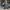 Woman pushing two children in a WonderFold stroller wagon with a Winter Cover while strolling past storefronts
